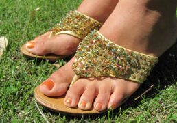 Hand-beaded wedged-heel thong sandals